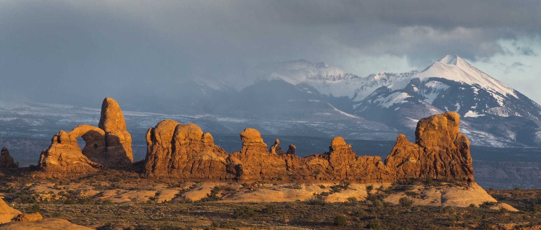 Snow-capped mountains and landscape with clouds